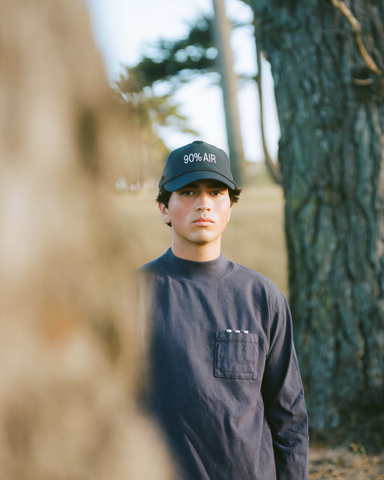 The Tree Hat and Work Shirt worn against a cypress trunk