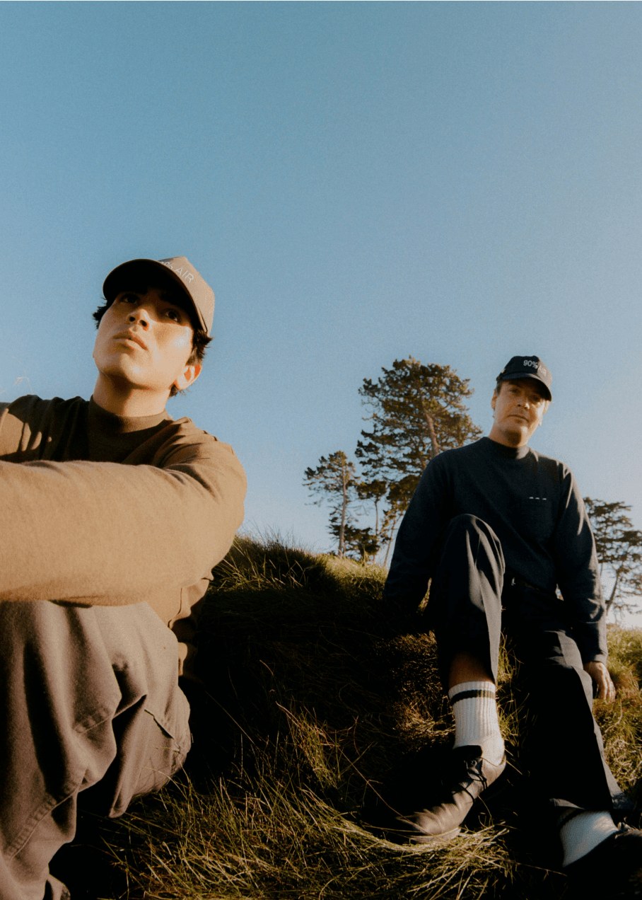 Two golfers at golden hour on a dune ridge, both in Agronomy Workshop