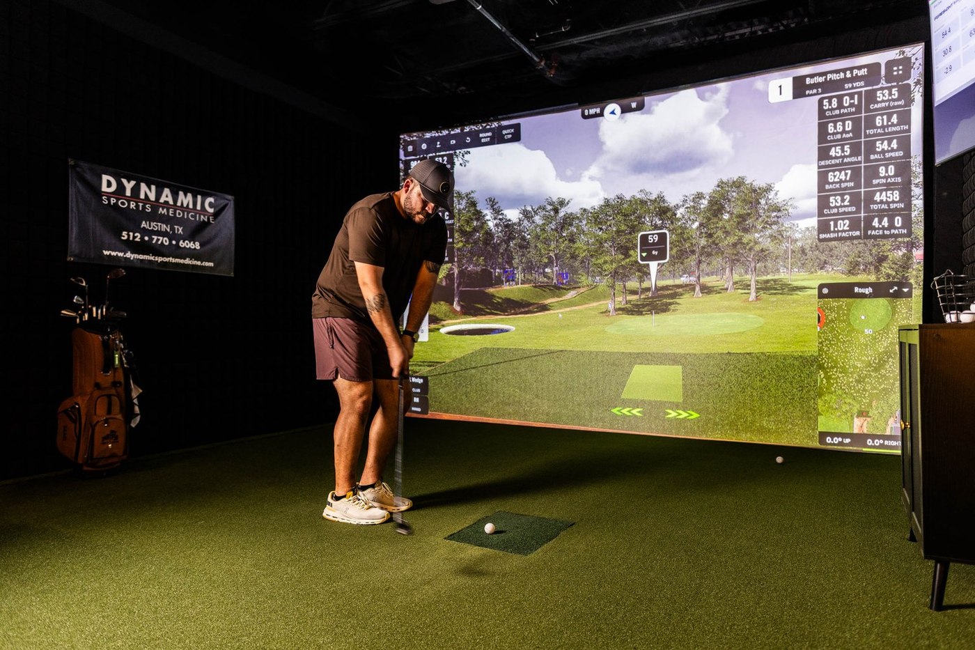 A player lining up a shot in a bay at 1872 Golf Club
