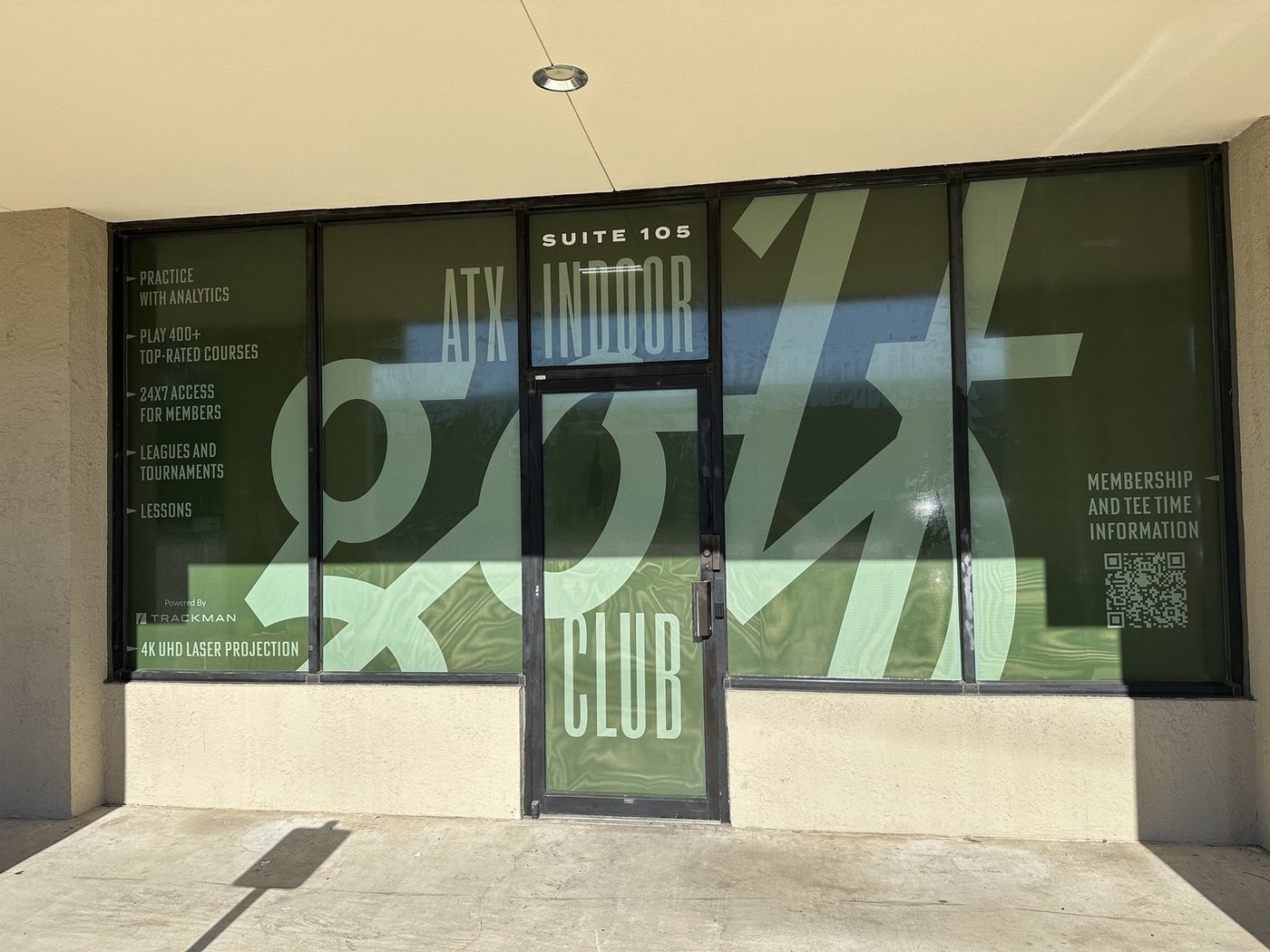 The ATX Indoor Golf Club storefront on the US 290 service road