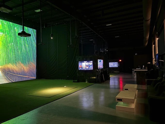 Wide interior view of the two-bay Fiber Golf room in southwest Austin