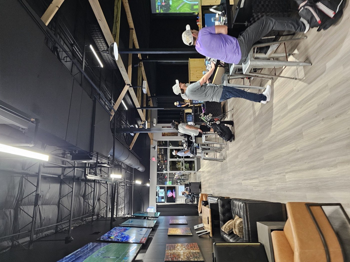 One-to-one instruction in a simulator bay at ROK Golf