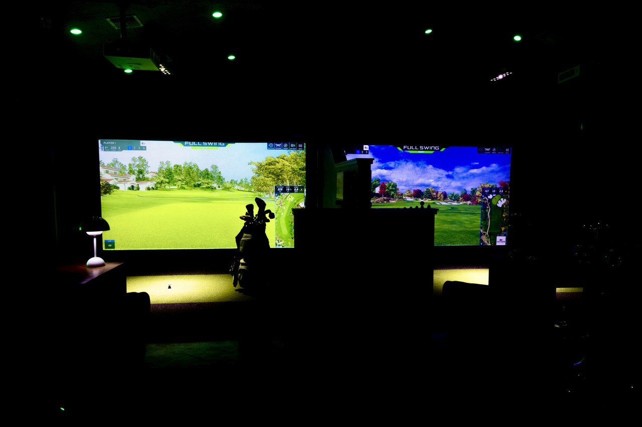 The bay floor at Swing Station with multiple screens lit