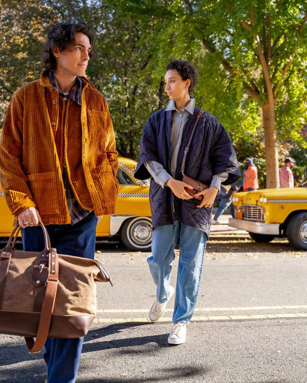 Two men walking down a street with a Billykirk leather bag