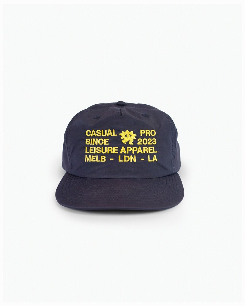 Casual Pro snapback in navy reading SINCE 2023 LEISURE APPAREL MELB LDN LA