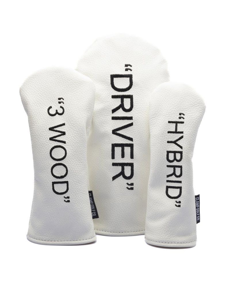 White leather word covers reading Driver, 3 Wood and Hybrid