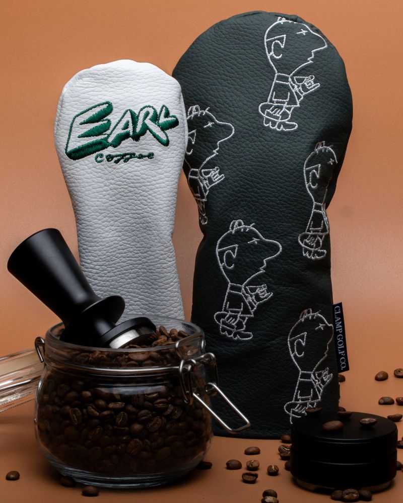 Custom black and white headcovers styled with coffee beans