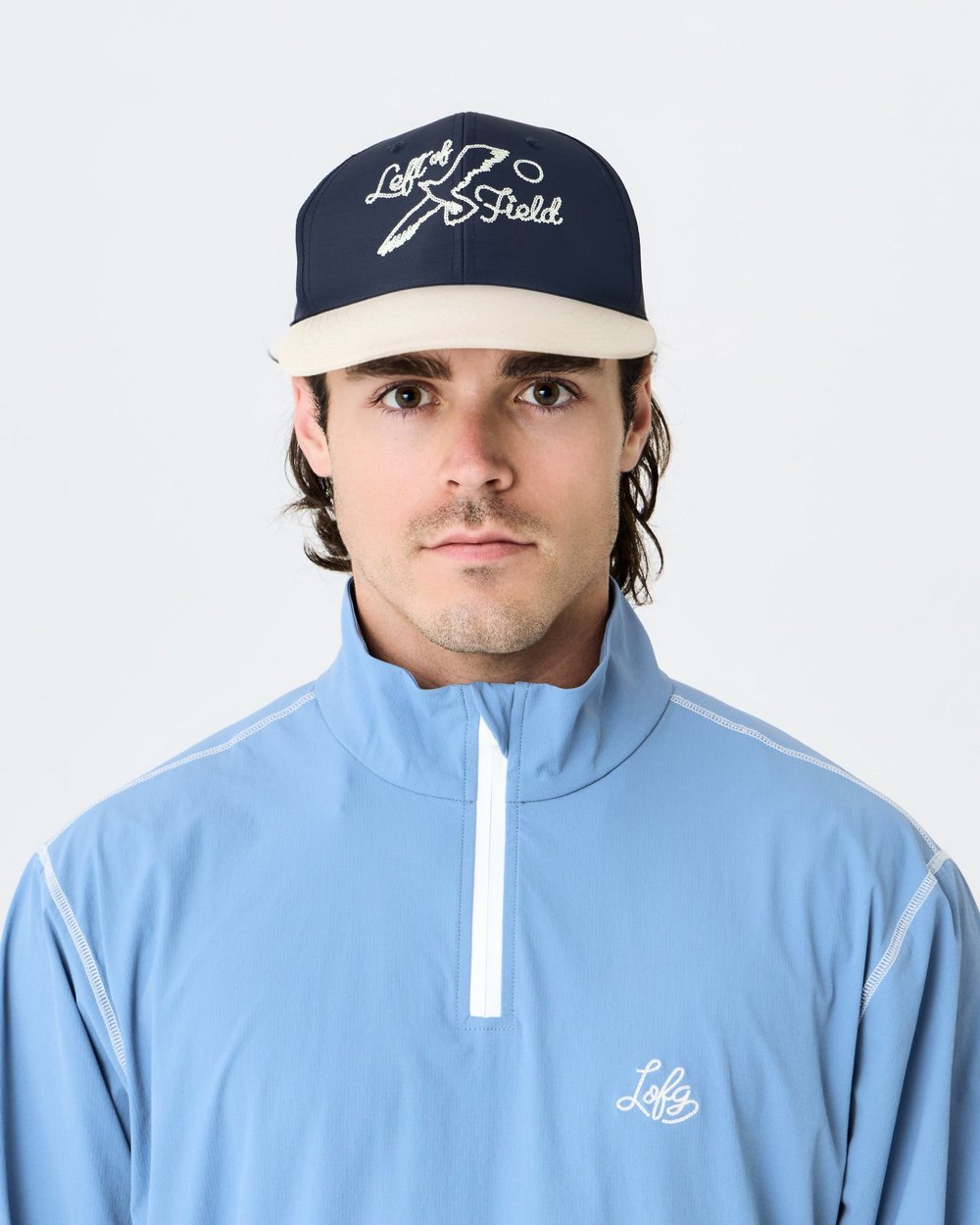 A model in Left of Field's navy and cream Duckbill Birds Cap