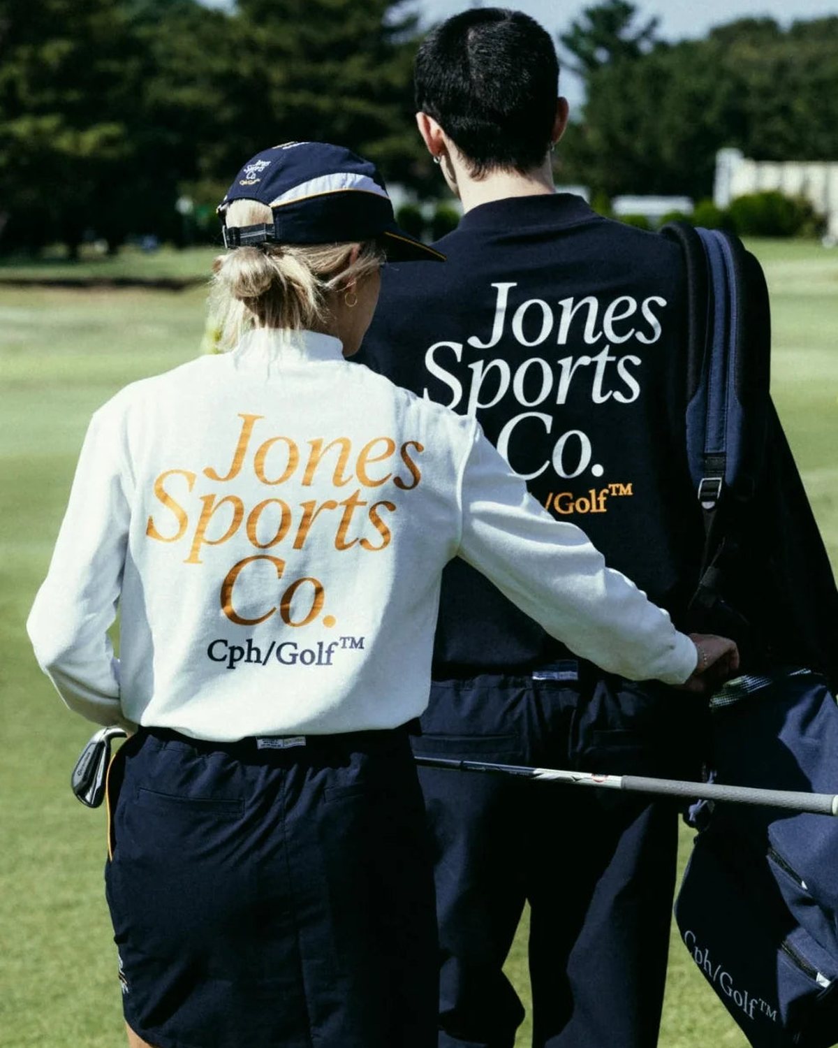A player in a white mock neck seen from behind, from Cph/Golf&rsquo;s lookbook for the Jones collaboration