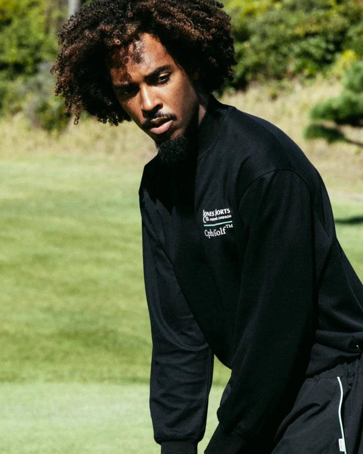 Three players in the collaboration pieces on a green, from Cph/Golf&rsquo;s lookbook for the Jones collaboration