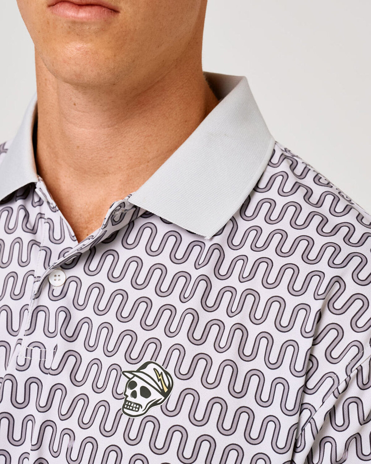 Devereux polo collar and skull caddie print detail