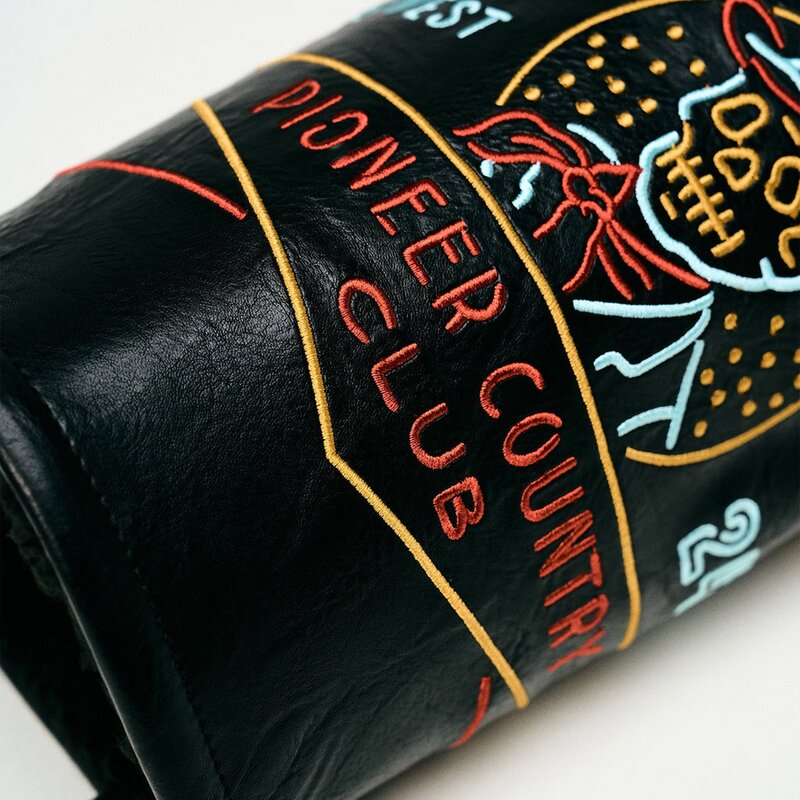 Pioneer Country Club neon-sign embroidery on black leather