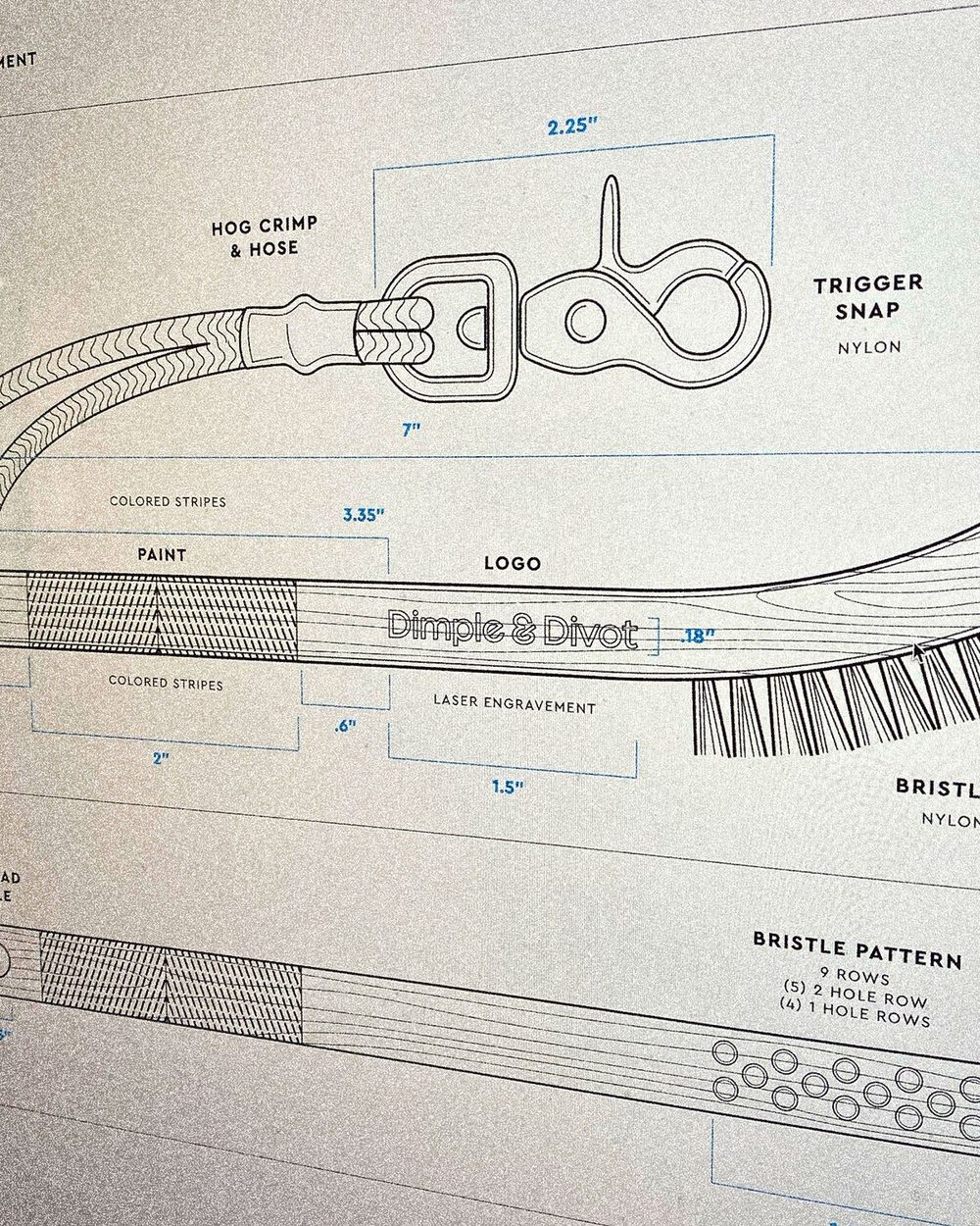 A technical drawing of the Dimple & Divot brush with its trigger snap and bristle pattern