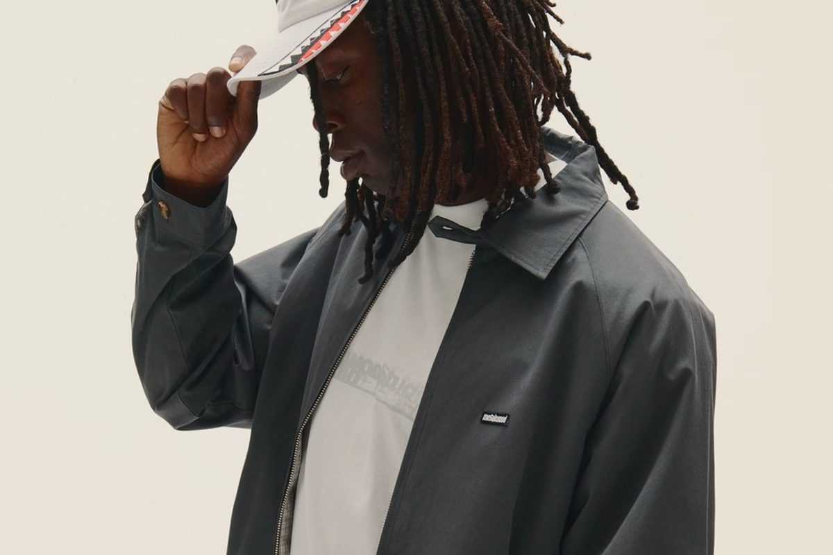 A Metalwood model in a dark jacket and white cap from the FW26 lookbook