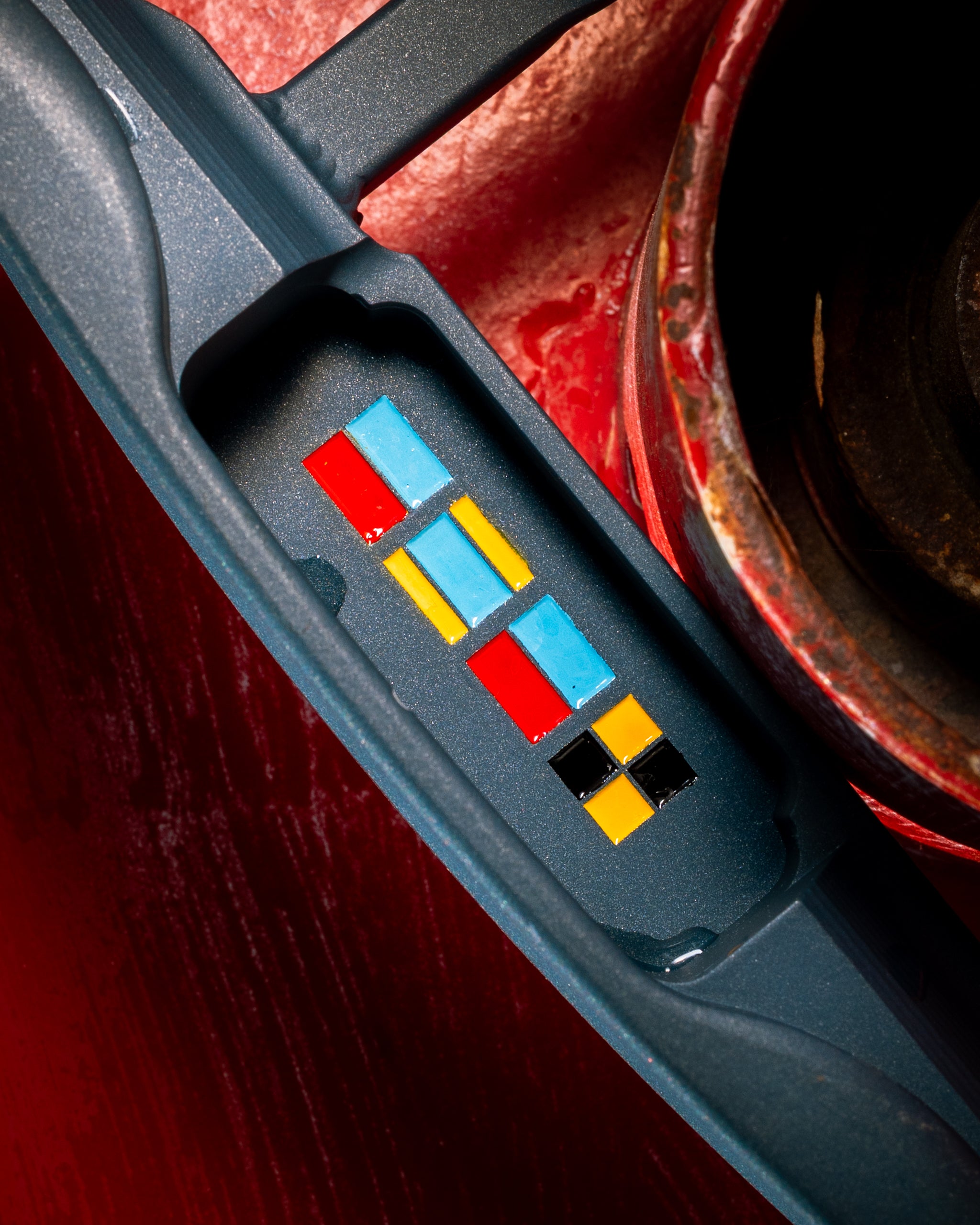 Maritime signal-flag inlays on the Bowline sole, against a rust-red buoy