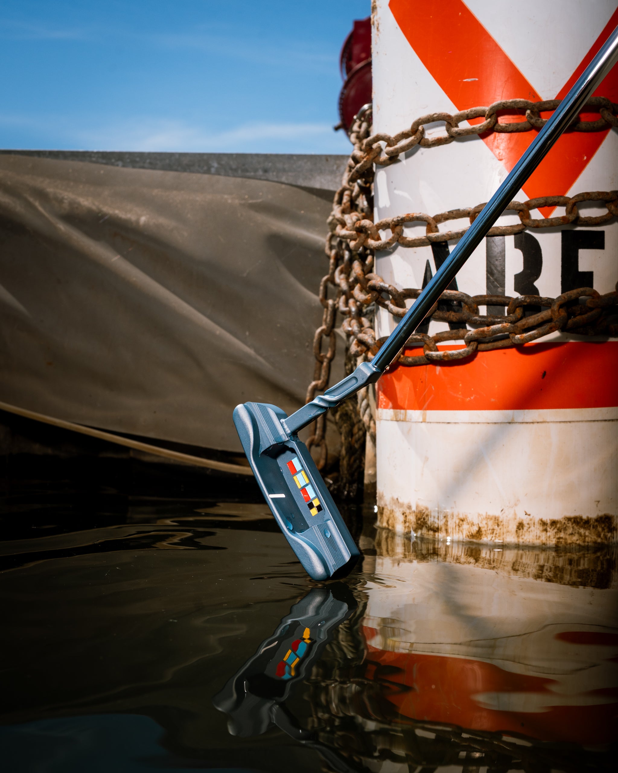 The Bowline at the water's edge beside a channel marker