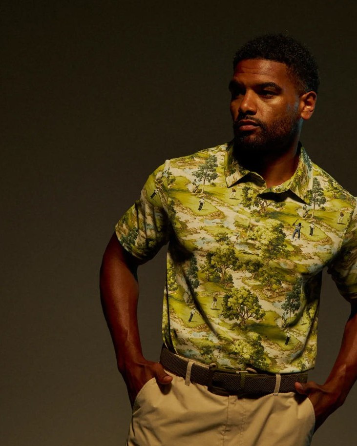 A man in Eastside Golf's Course Camo snap placket polo