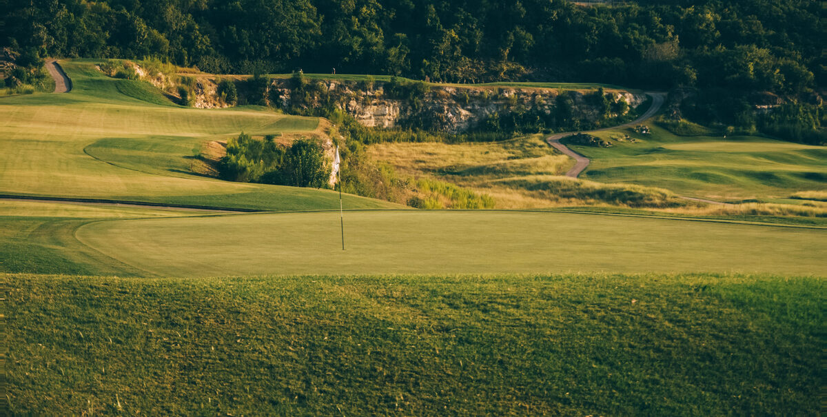 The Quarry Golf Club — back nine descending into limestone quarry walls