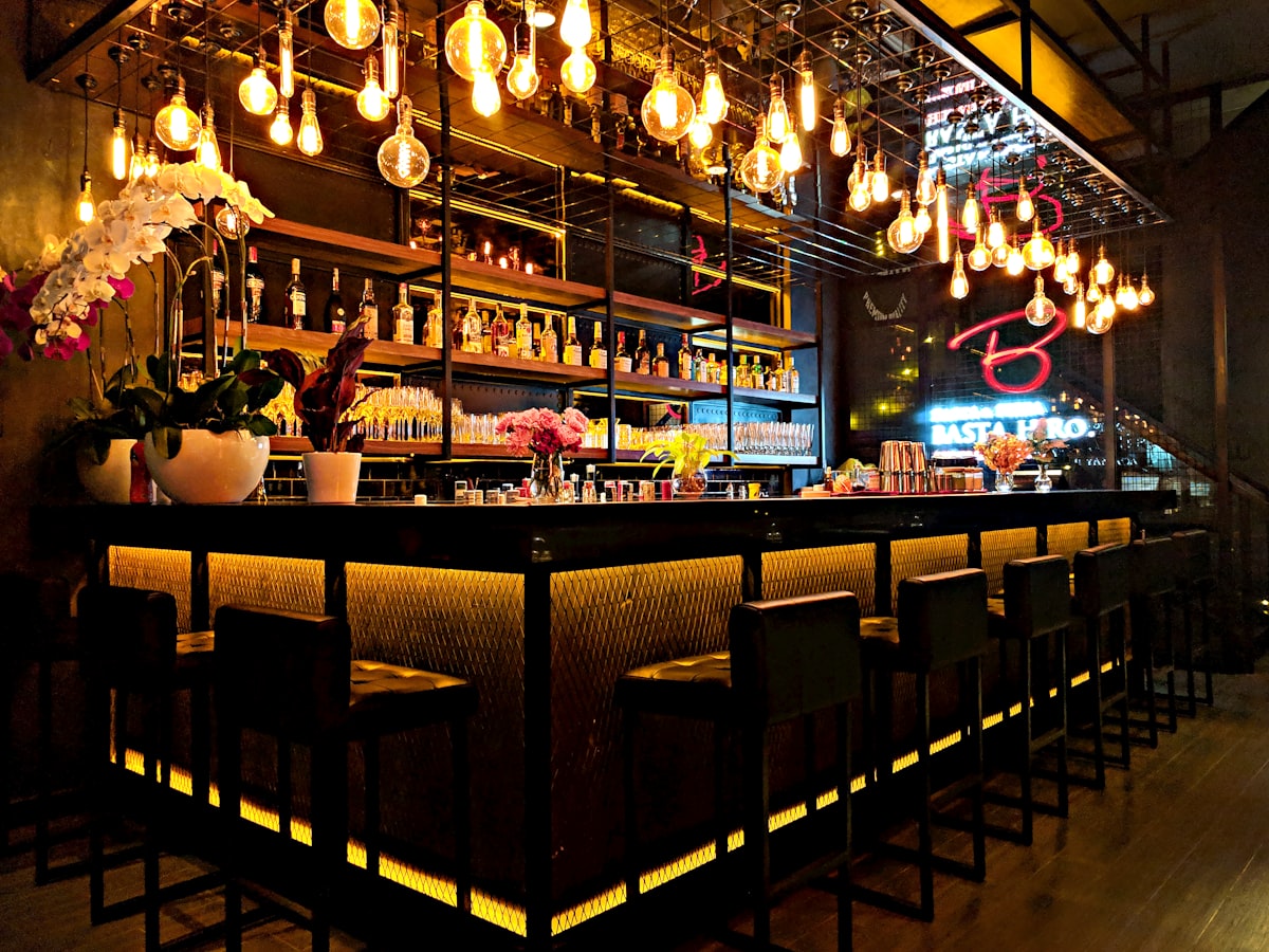 Neon signs and warm light at an Austin bar at night