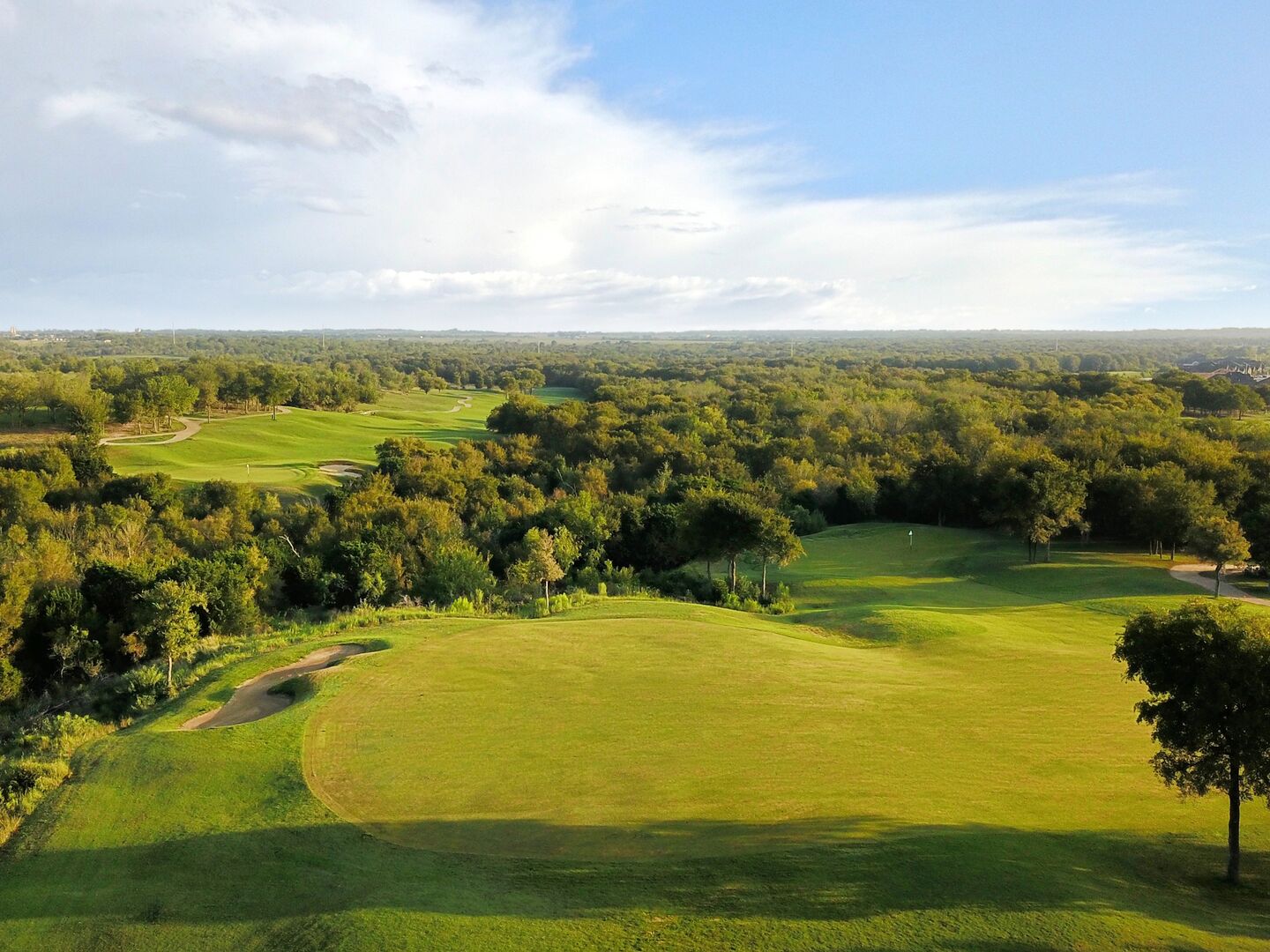 Elevated tee box with distant fairway at ShadowGlen Golf Club