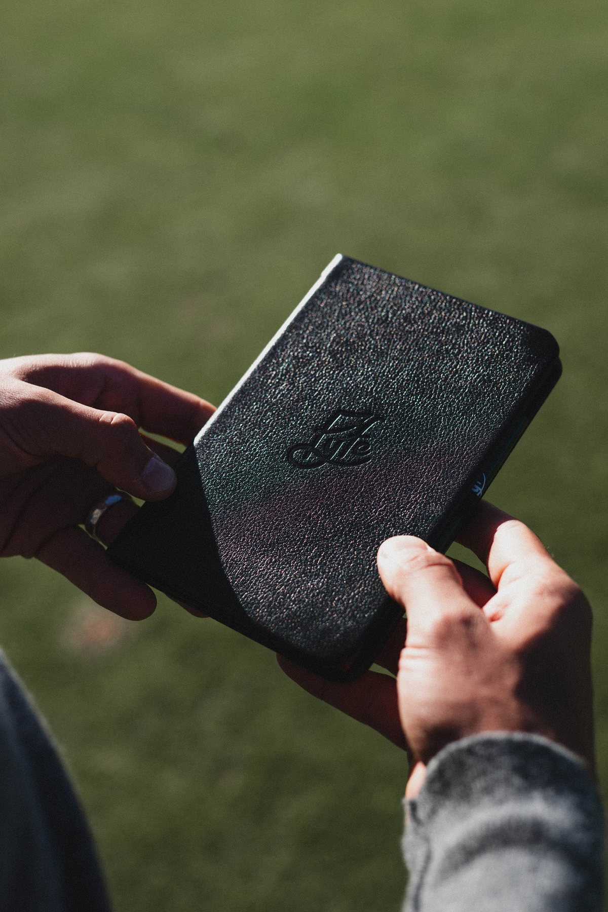 The Golfer’s Diary held over the grass