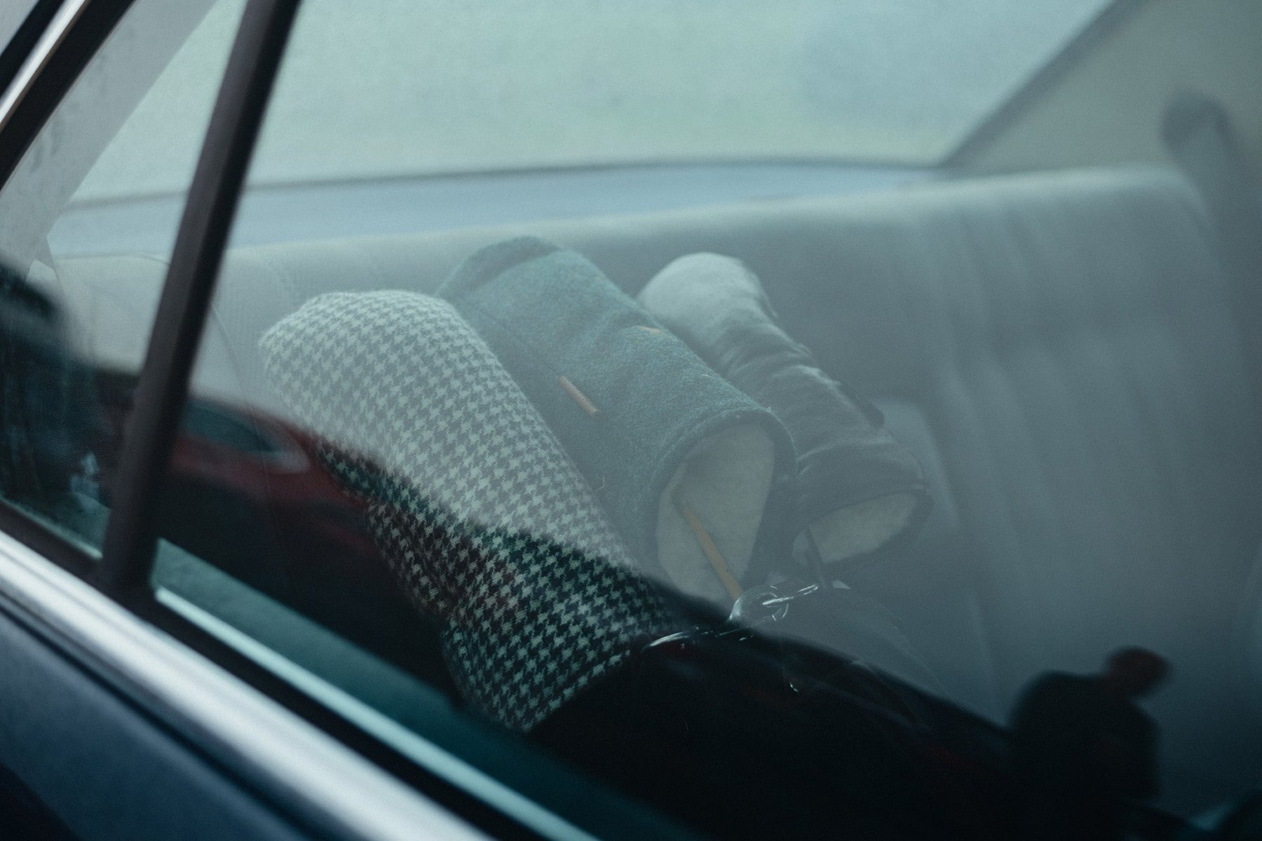 Tweed headcovers on the car’s back seat