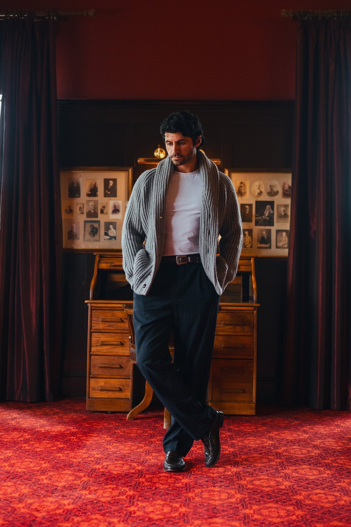 A man in the shawl cardigan in the clubhouse dining room