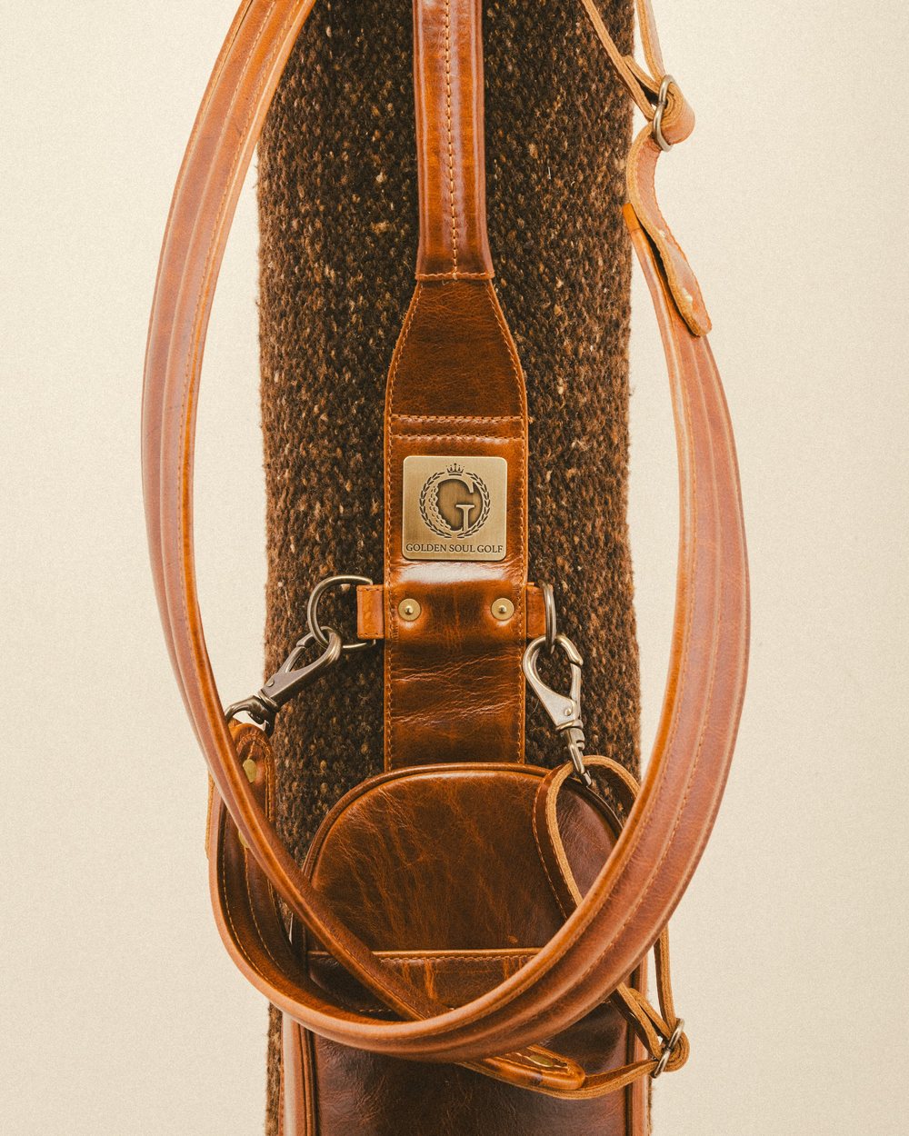 Close-up of a woven Sunday bag with leather straps and trim