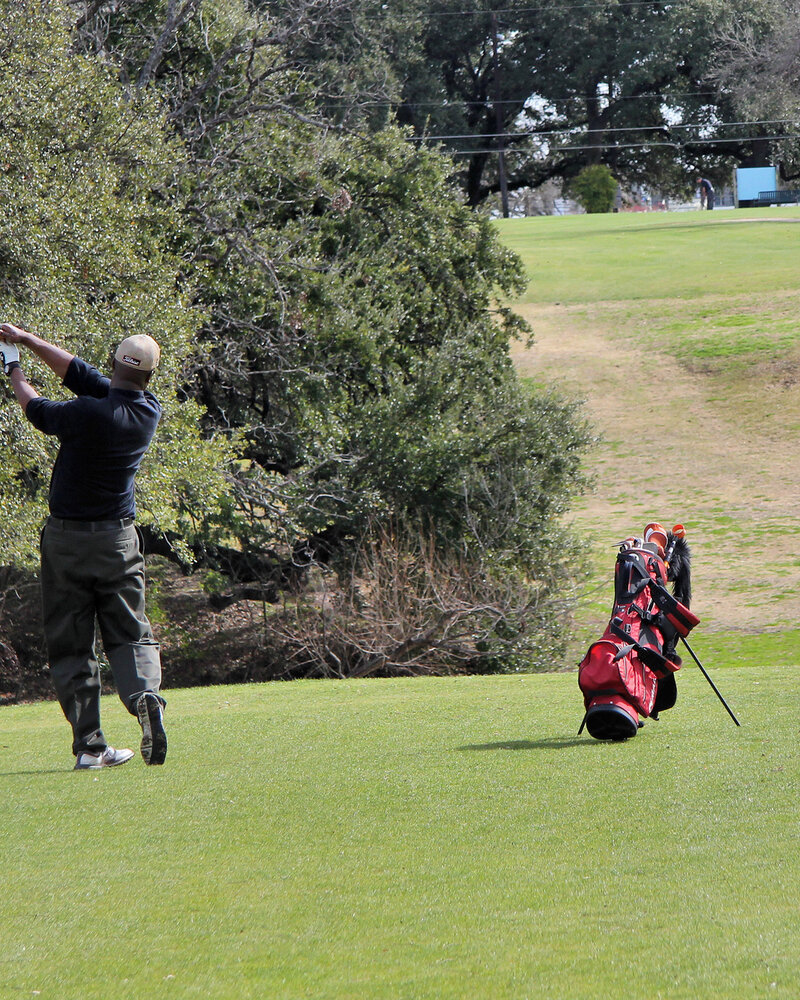 A golfer plays the 9th at Hancock Golf Course, Austin