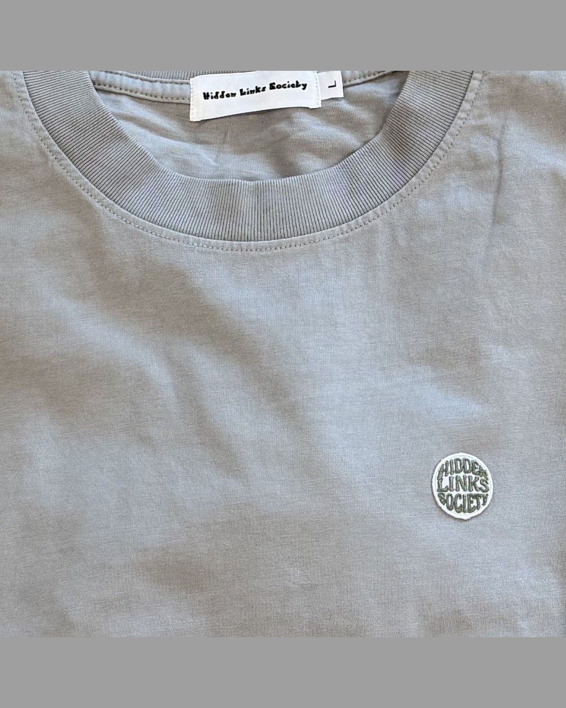 Light grey cotton tee with tonal chest patch by Hidden Links Society &middot; view 2 of 3