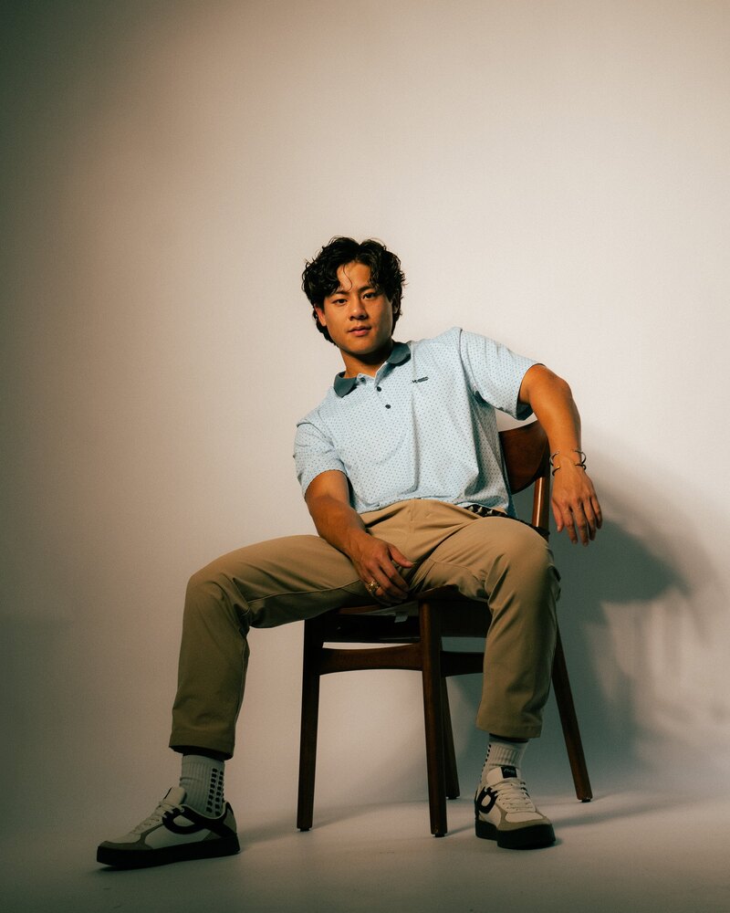 Kingfisher powder blue polo, seated portrait