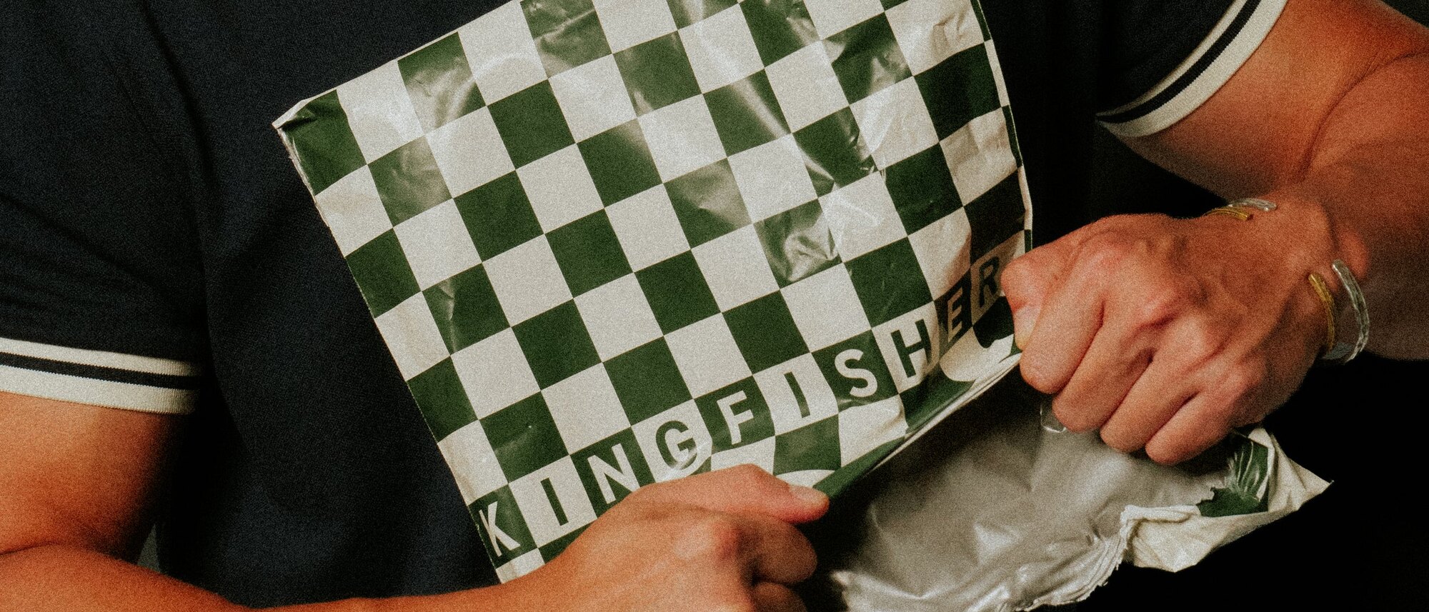 A Kingfisher Golf order in its green checkered mailer — Dallas