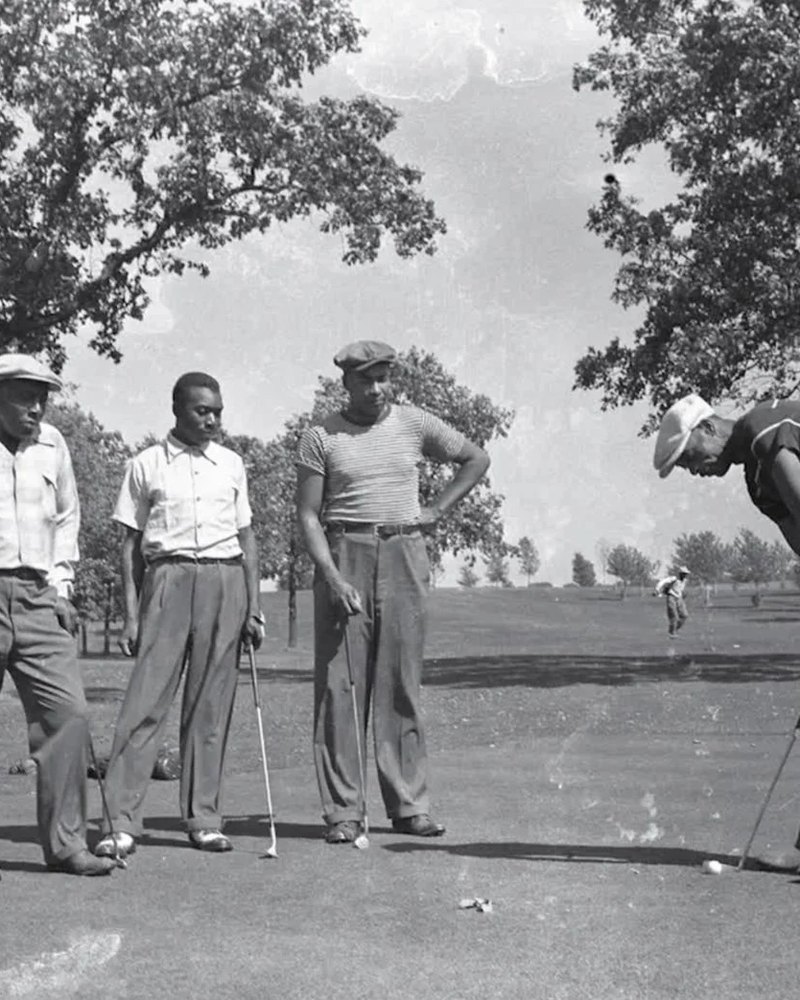 Four golfers on a green at Lions Municipal, black and white archival photo