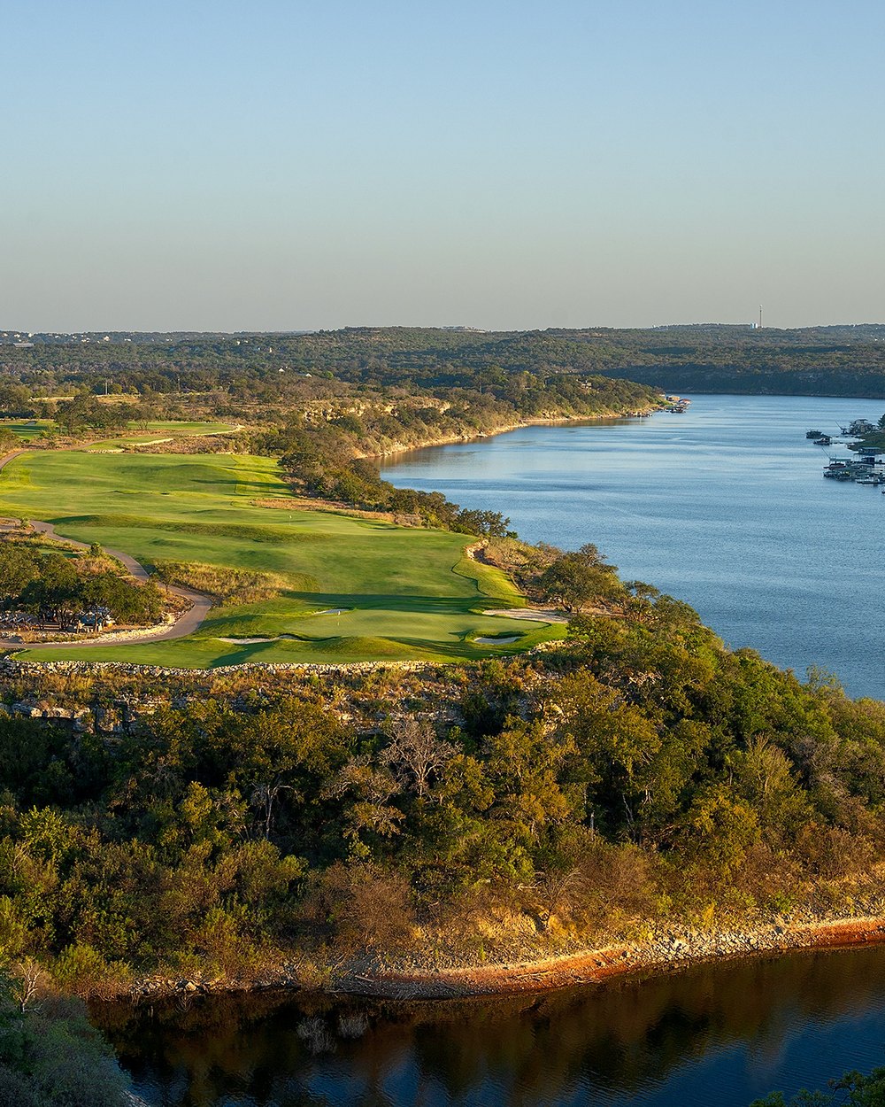 Aerial view of a Loraloma fairway beside a bend in the Pedernales River