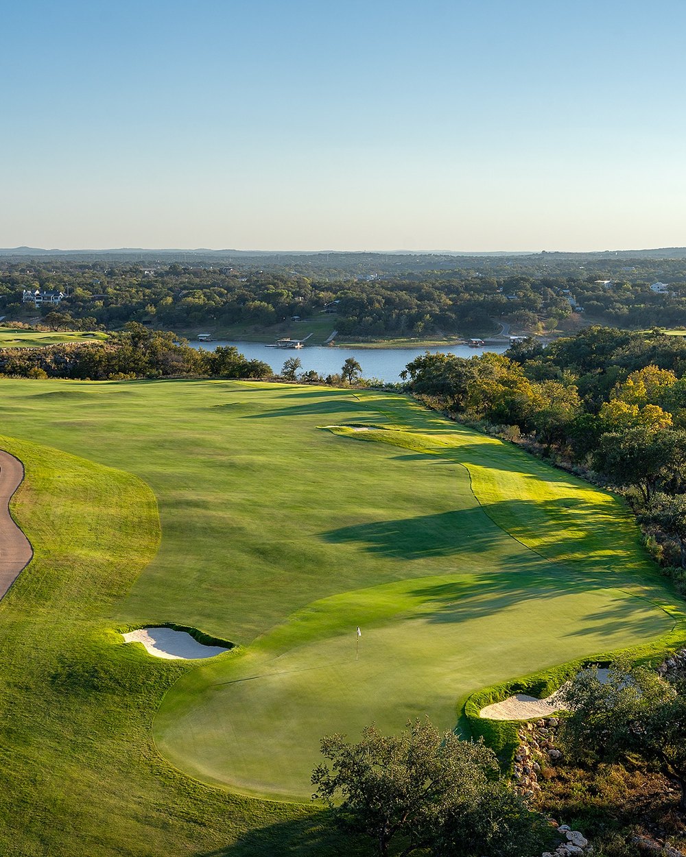Aerial view of a Loraloma hole cut through Hill Country scrub