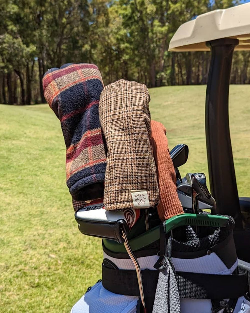 Check headcovers on a bag on a golf cart on the course