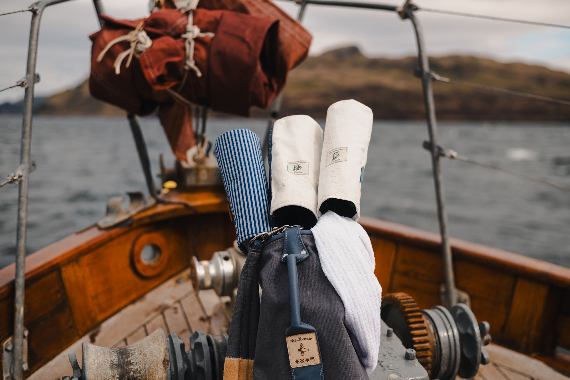 MacKenzie bags on a boat deck during the Fyfe Between Tides shoot