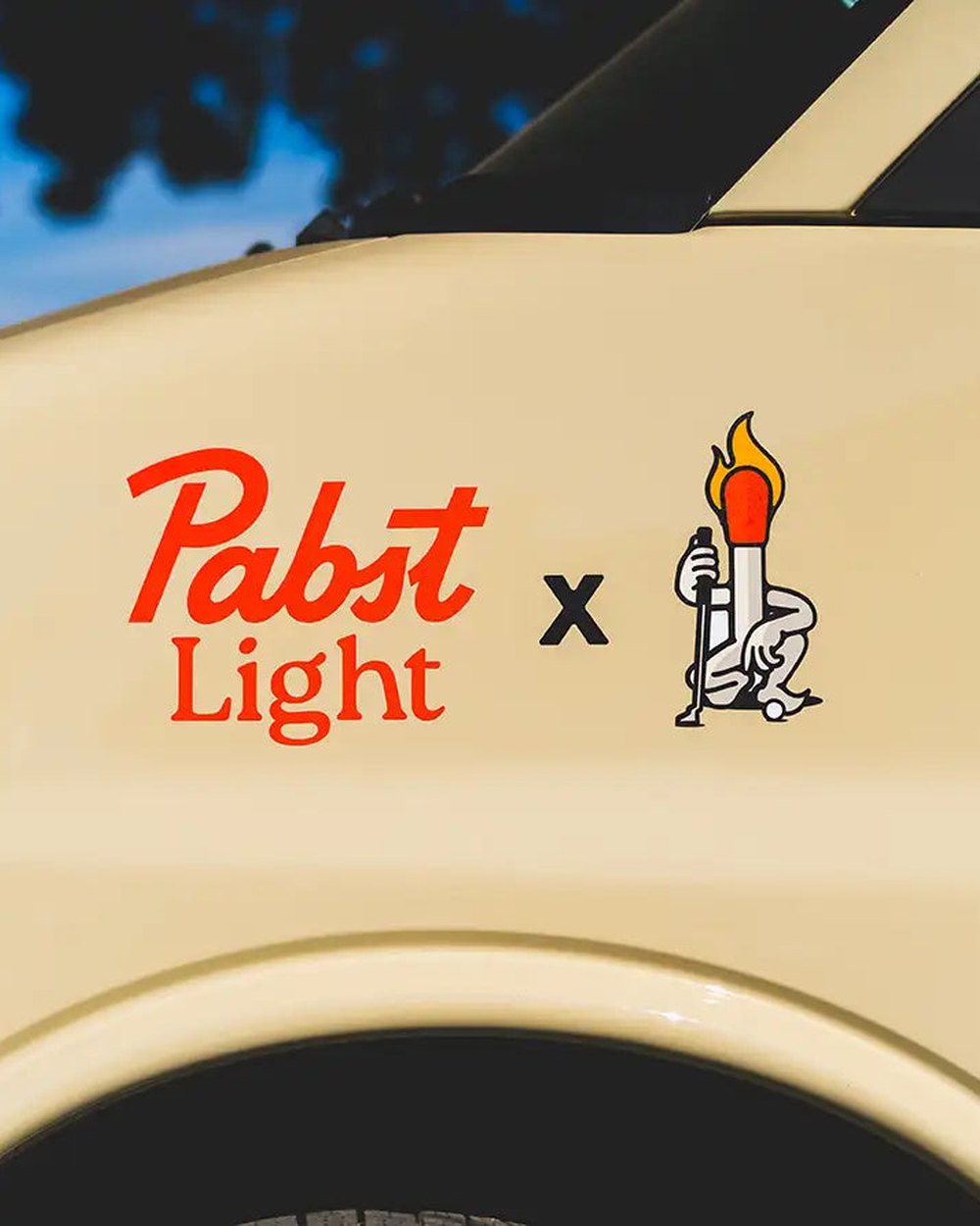 A Pabst Light and Matchstick Golf decal on the side of a golf cart
