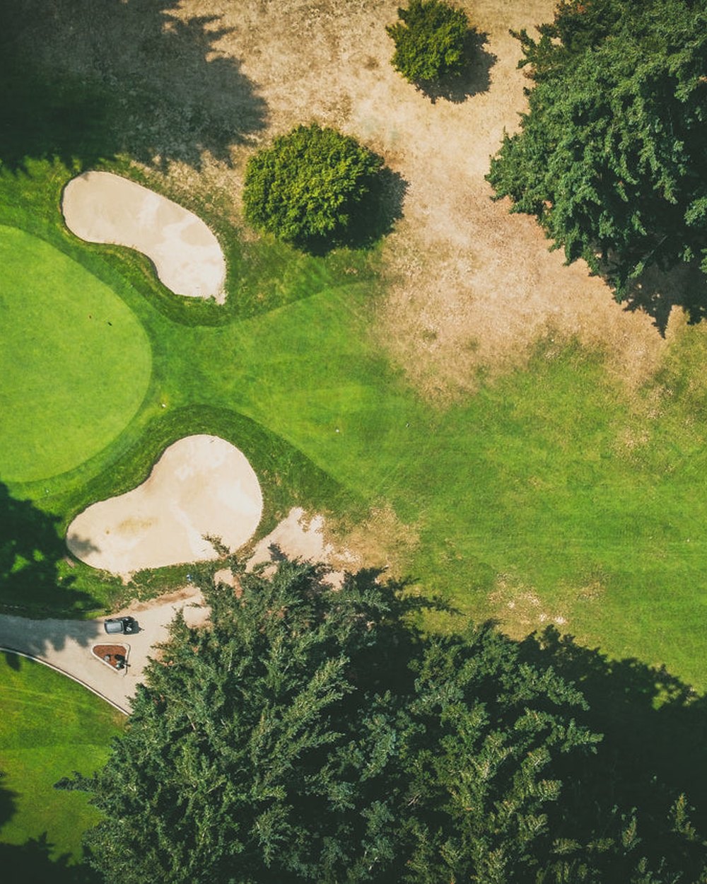 Aerial view of a green and bunkers at Glendoveer East in Portland