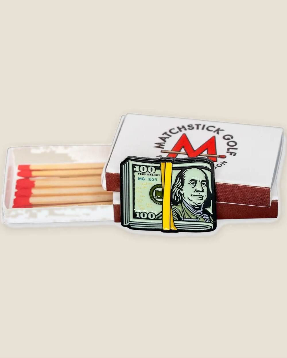 A stack of Matchstick matchboxes with a Cash Stack marker on top