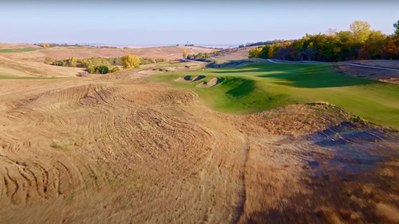 Low pass over native rough toward Landmand's 14th green
