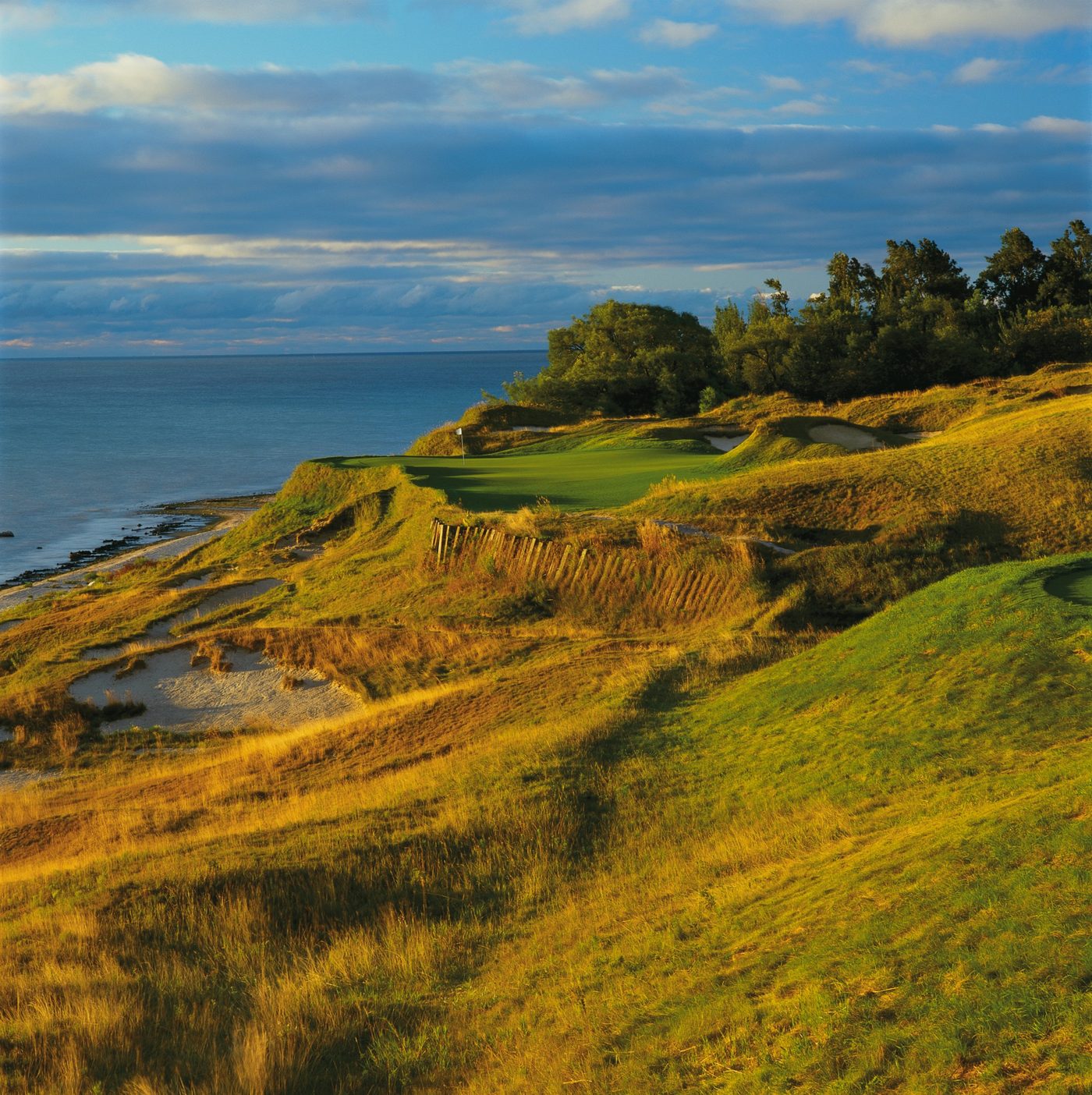 The par-3 17th green, Pinched Nerve, on a lakeside bluff at Whistling Straits