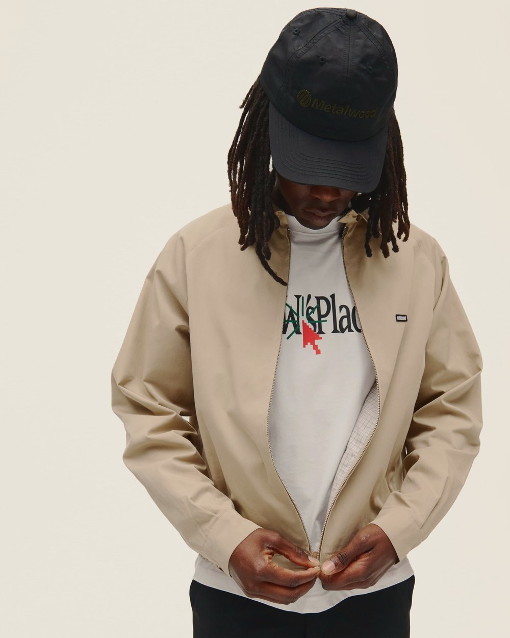 A man in the tan Raglan Sleeve Blouson over the MW Place T-Shirt