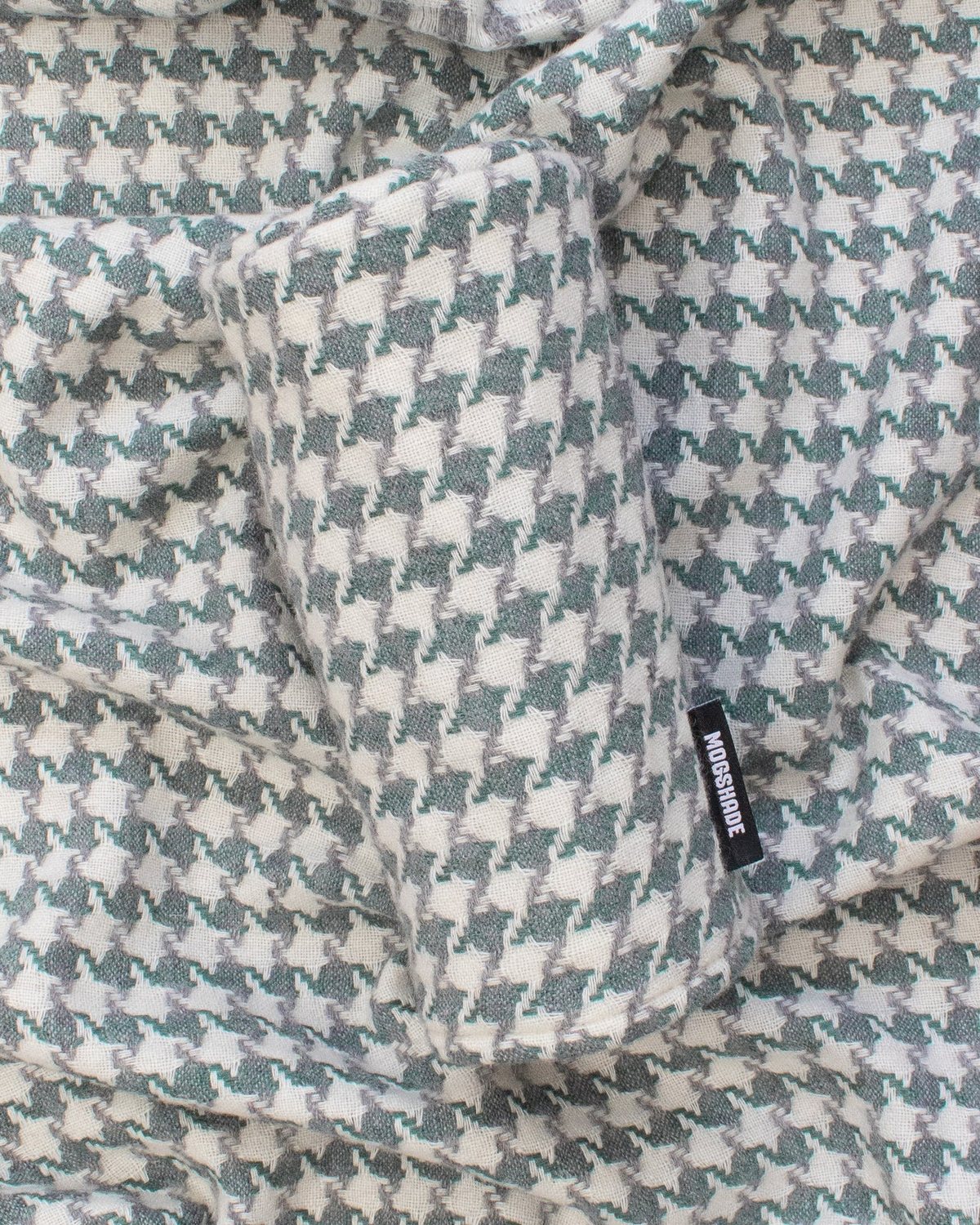A Mogshade houndstooth lichen headcover on matching fabric