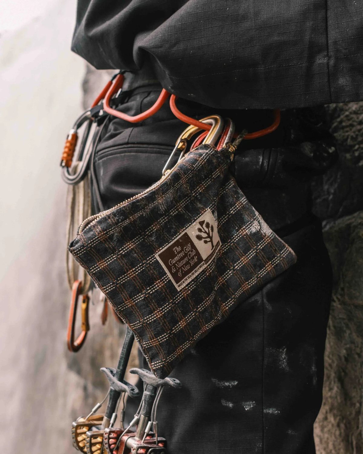 A Gumtree x Wynn valuables pouch clipped to a climbing harness, from Gumtree's lookbook