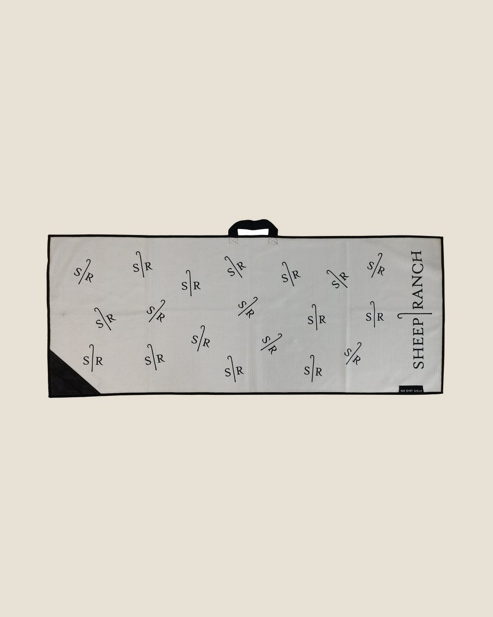 A gray custom No Dirt towel printed with the Sheep Ranch logo