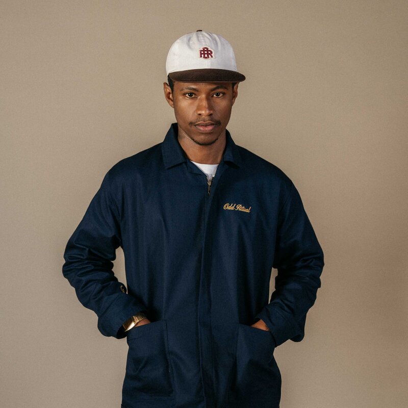 Odd Ritual The Caddie Jacket — Navy, on model