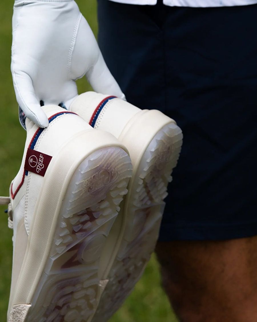 A golfer in the REEF x Palm G-Papi on the green