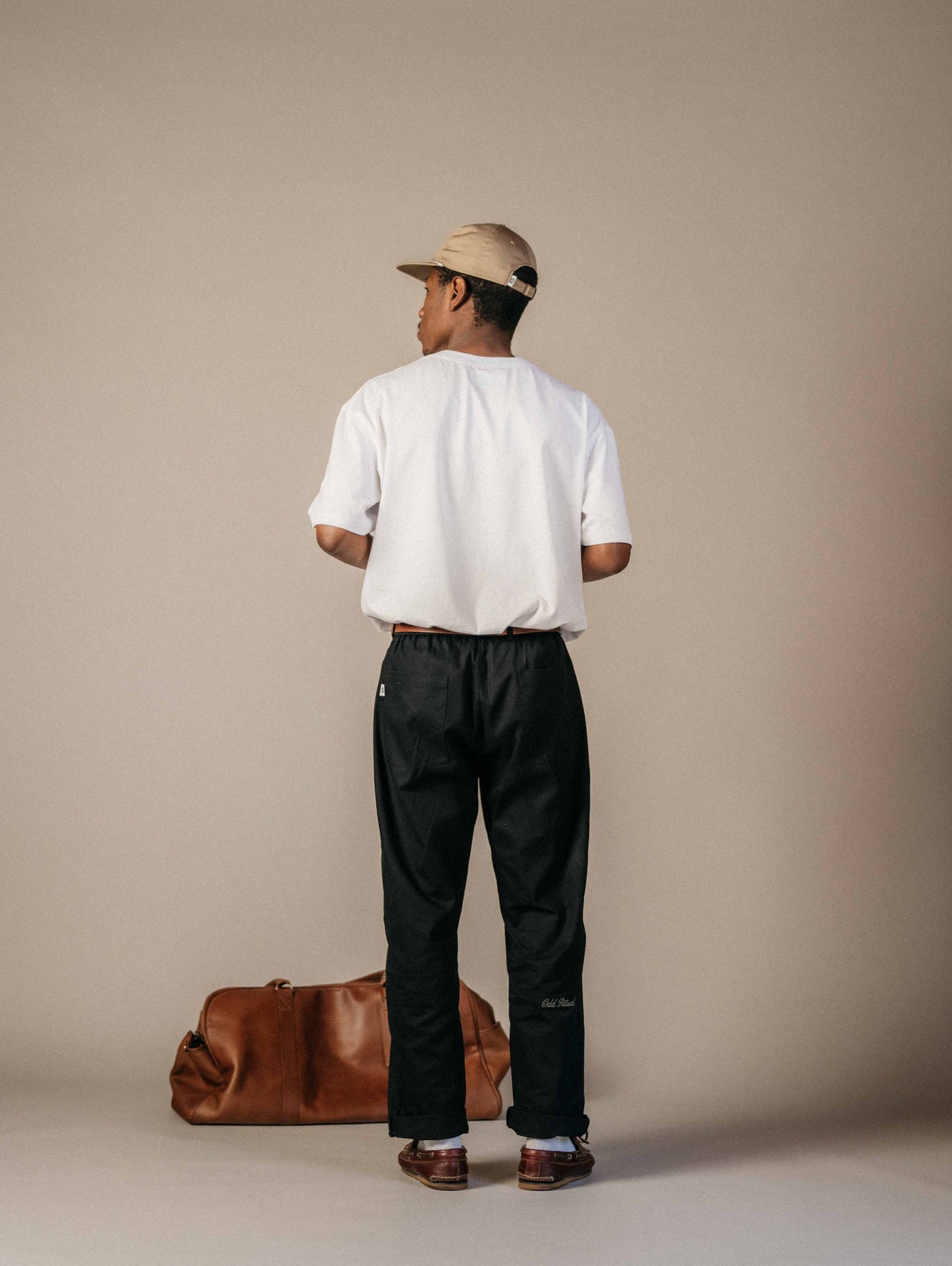 Odd Ritual pleated trouser from behind, showing the break