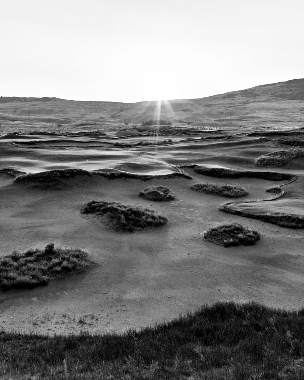 Black and white aerial of bunkers and fairways at Gamble Sands